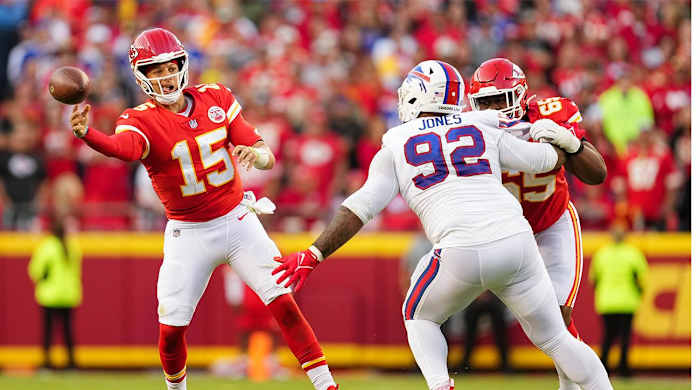 Oct 16, 2022; Kansas City, Missouri, USA; Kansas City Chiefs quarterback Patrick Mahomes (15) throws a pass as Buffalo Bills defensive tackle DaQuan Jones (92) defends during the second half at GEHA Field at Arrowhead Stadium.